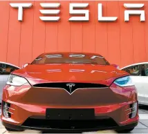  ?? AFP-Yonhap ?? In this file photo the logo marks the showroom and service center for the U.S. automotive and energy company Tesla in Amsterdam on Oct. 23, 2019.