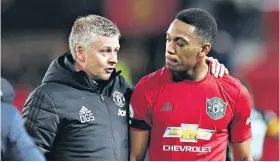  ??  ?? Support: Ole Gunnar Solskjaer gives some words of advice to Anthony Martial