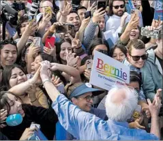  ?? Allen J. Schaben Los Angeles Times ?? BERNIE SANDERS, though 78, is the presidenti­al candidate who most inspires youthful voters, including these in Santa Ana last week.