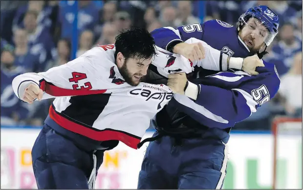  ?? CHRIS O’MEARA/AP ?? Lightning defenceman Braydon Coburn (right) and Capitals winger Tom Wilson go to-to-toe during the first period of Game 7 last night.