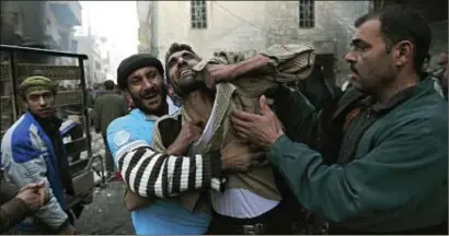  ?? PHOTO: REUTERS ?? A father’s distress after the death of two of his children as a result of shelling in Aleppo, Syria, last week You Trees, Langer Karowski lyn E. Gootman