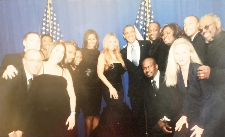  ??  ?? Loris (at far right), with Michelle and Barack Obama, surrounded by friends, family and colleagues at the Waldorf Astoria, in New York, in 2012. Holland and Carey had co-written a song, titled, ‘Bring It On Home,’ for the former president’s re-election campaign