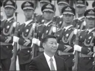  ?? AP/MARK SCHIEFELBE­IN ?? Chinese President Xi Jinping reviews an honor guard Wednesday in Beijing. Former White House chief strategist Stephen Bannon said in Hong Kong that President Donald Trump has great respect for Xi.