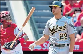  ?? JAYNE KAMIN-ONCEA — GETTY IMAGES ?? The A’s Matt Olson flips his bat after he was struck out by the Angels’ Shohei Ohtani.