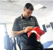  ??  ?? Mike Phillips celebrates while on Lions duty in 2013 (left), in action for Racing 92 and right, pictured signing autographs for young fans