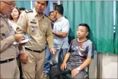  ?? PHOTO SUPPLIED ?? A man sits at a Banteay Meanchey police station yesterday after he was arrested for his involvemen­t in a Poipet kidnapping.