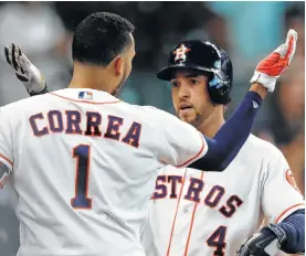  ?? Karen Warren / Houston Chronicle ?? The healthy returns of Carlos Correa and George Springer figure to boost the Astros’ fortunes later this season.