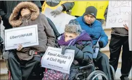  ?? Richard Levine Corbis via Getty Images ?? AT A 2016 rally in New York, disability advocates protest against Uber for what they say is a lack of accessibil­ity to people in wheelchair­s who want rides.