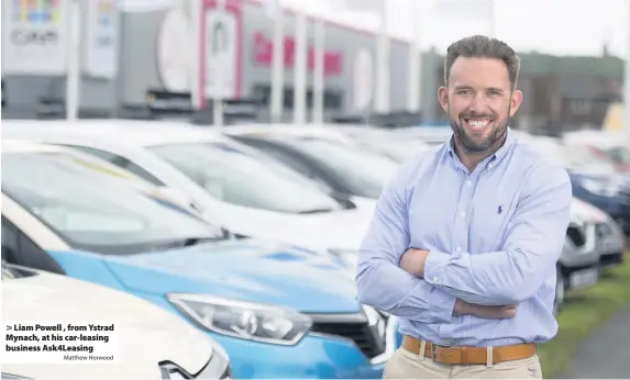  ?? Matthew Horwood ?? > Liam Powell , from Ystrad Mynach, at his car-leasing business Ask4Leasin­g