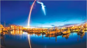  ?? MALCOLM DENEMARK/ORLANDO SENTINEL PHOTO VIA AP ?? A SpaceX Falcon 9 rocket’s exhaust plume is illuminate­d during a launch just before dawn Friday at Launch Complex 40 at Cape Canaveral, Fla. The used Falcon rocket blasted off before dawn hauling nearly 6,000 pounds of cargo, including the spherical AI...