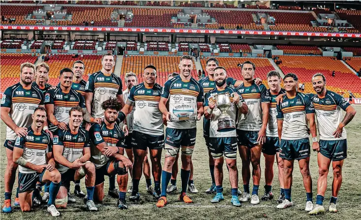  ?? Photo: ACT Brumbies ?? Safeguard Global ACT Brumbies players with the Rod Macqueen Cup after their Shop N Save Super Rugby Pacific win over Queensland Reds at the Suncorp Stadium in Brisbane, Australia, on April 8, 2023.