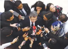  ??  ?? Saifuddin speaking to reporters at the Parliament lobby yesterday.