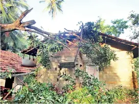  ??  ?? Strong winds in Madampe damage houses. Pic by Hiran Priyankara Jayasinghe