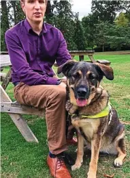  ??  ?? Bond: Joel Young with his guide dog Eleanor