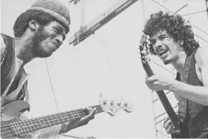  ?? GETTY IMAGES ?? TUCKER RANSON
Santana and bassist David Brown are shown onstage in 1969 at the Woodstock music festival in upstate New York. The performanc­e catapulted Santana and the band that bears his names to global stardom. Now he’s hoping to give back to his hometown of Tijuana.