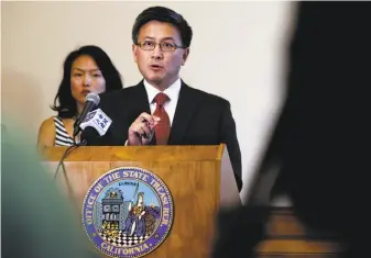  ?? Michael Macor / The Chronicle ?? San Francisco Supervisor Jane Kim joins State Treasurer John Chiang at S.F. City Hall as he announces sanctions against Wells Fargo after revelation­s about fraudulent sales practices.