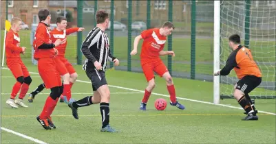  ??  ?? Gary Train heads to goal in the game against Helensburg­h at the all-weather pitch last Saturday.