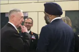  ?? VIRGINIA MAYO, THE ASSOCIATED PRESS ?? U.S. Secretary of Defense Jim Mattis, left, speaks with Canadian Defense Minister Harjit Singh Sajjan, second right, at NATO headquarte­rs in Brussels on Thursday.