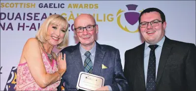  ??  ?? Lifetime Achievemen­t winner Dr Finlay McLeod with Cathy MacDonald and sponsor Donald McLeod at the Gaelic Awards.