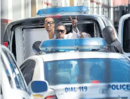  ?? FILE ?? Vybz Kartel makes a sign as he enters the Home Circuit court on Thursday, April 3, 2014, for sentencing.