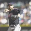  ?? Stephen Brashear / Getty Images ?? Indians starter Corey Kluber delivers a pitch during the third inning against the Mariners on Sept. 24 at Safeco Field.