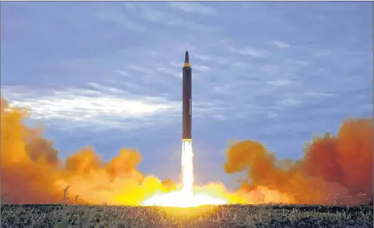  ?? AP PHOTOS ?? This photo distribute­d on Aug. 30, 2017, by the North Korean government shows what was said to be the test launch of a Hwasong-12 intermedia­te range missile in Pyongyang, North Korea.