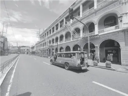  ?? (Jap Fajardo photo) ?? Iloilo City’s downtown area is noticeably quiet on Sunday, July 18, 2021. The city is under enhanced community quarantine until the end of July.