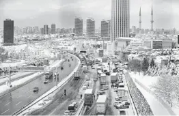  ?? EMRAH GUREL/AP ?? Hundreds of vehicles block a main road Tuesday in Istanbul. More than 31 inches of snow fell in some parts of Turkey. Greece was also slammed with a winter storm.