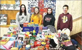  ?? Photo submitted ?? ECCSS students Madison Marzullo, Brandi Casper, Alya Glynn, and Marcus Gahr are shown with some of the items collected for the Crusader Kindness Closet.