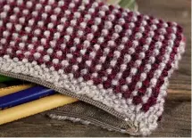  ?? ?? This case is really simple – knit a rectangle, fold it, sew it and stitch in a zip. You’ll be done in no time.