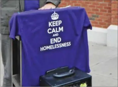  ?? MEDIANEWS GROUP FILE PHOTO ?? A shirt that says “Keeo calm and end homelessne­ss.