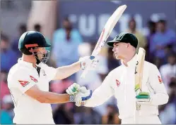  ?? AP ?? Shaun Marsh (L) and Peter Handscomb batted through the second session to ensure Australia drew the third Test in Ranchi.