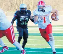  ?? MARLENE BUTLER ?? Tinley Park quarterbac­k Evan King accounted for five touchdowns Friday during the Titans’ 32-12 win over T.F. North.