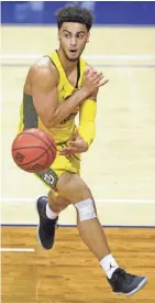  ?? MARK HOFFMAN / MILWAUKEE JOURNAL SENTINEL ?? Marquette guard Markus Howard is friends with Oregon’s Troy Brown.