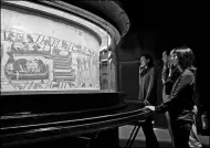  ?? MAIRIE DE BAYEUX VIA ASSOCIATED PRESS ?? Visitors examine a section of the 11th century Bayeux tapestry in Normandy, France.