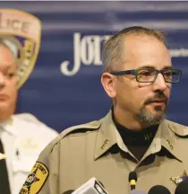  ?? JOHN J. KIM/CHICAGO TRIBUNE ?? Dan Jungles, right, deputy chief with the Will County sheriff’s office, answers reporters’ questions about the fatal shooting of eight people as Joliet police Chief Bill Evans listens during a news conference Tuesday at Joliet City Hall.