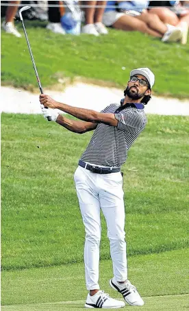  ?? ERIK WILLIAMS ■ USA TODAY SPORTS ?? Akshay Bhatia hits an approach shot on the first playoff hole during the final round of the Valero Texas Open golf championsh­ip Sunday in San Antonio.