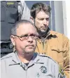  ?? CP FILE PHOTO ?? John Mark Tillmann (rear), charged with possession of stolen property, is escorted by sheriffs from provincial court in Dartmouth, N.S., in February 2013.