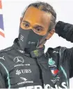  ?? REUTERS ?? Mercedes’ Lewis Hamilton celebrates on the podium after winning the Bahrain Grand Prix on Sunday.