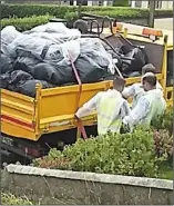  ??  ?? Contractor­s removing some of the bags.