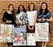  ?? ?? Adopt-A-Senior program is held each holiday season by Cherokee County Senior Services. Donated gift bags are delivered to the CCSS clients. Pictured from left: Leslie White, Jasmine McKinney, HDM Supervisor/Volunteer Coordinato­r Alice O. Micham and Brittany Kiser.