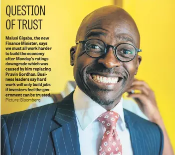  ?? Picture: Bloomberg ?? Malusi Gigaba, the new Finance Minister, says we must all work harder to build the economy after Monday’s ratings downgrade which was caused by him replacing Pravin Gordhan. Business leaders say hard work will only build jobs if investors feel the...