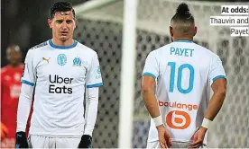  ??  ?? At odds: Thauvin and Payet