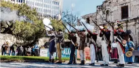  ?? Josie Norris/Staff photograph­er ?? Living history reenactors fire muskets during the annual commemorat­ion of the 13-day siege and battle at the Alamo on Feb. 23 in San Antonio.