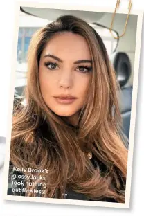  ??  ?? Kelly Brook’s glossy locks look nothing but flawless!