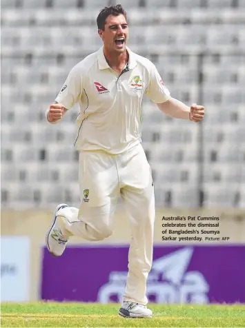  ?? Picture: AFP ?? Australia’s Pat Cummins celebrates the dismissal of Bangladesh’s Soumya Sarkar yesterday.