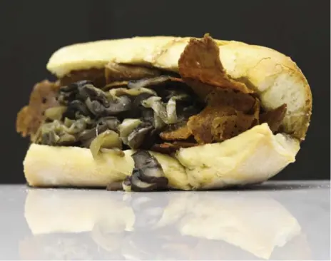  ?? RANDY RISLING/TORONTO STAR ?? The Hogtown Vegan, a popular eatery in Toronto’s west end, serves up vegan comfort food, like this hot roast “beef” sandwich.