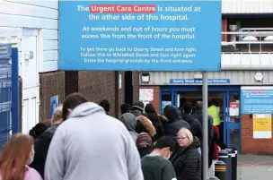  ??  ?? ●● People queuing for the coronaviru­s vaccine at Rochdale Infirmary in May this year