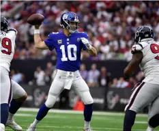  ??  ?? In this Sept. 23 photo, New York Giants quarterbac­k Eli Manning (10) throws a pass against the Houston Texans during the first half of an NFL football game in Houston. AP PhoTo/erIc chrISTIAn SMITh