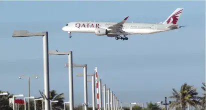  ??  ?? A QATAR AIRWAYS plane is seen in Doha on Monday.